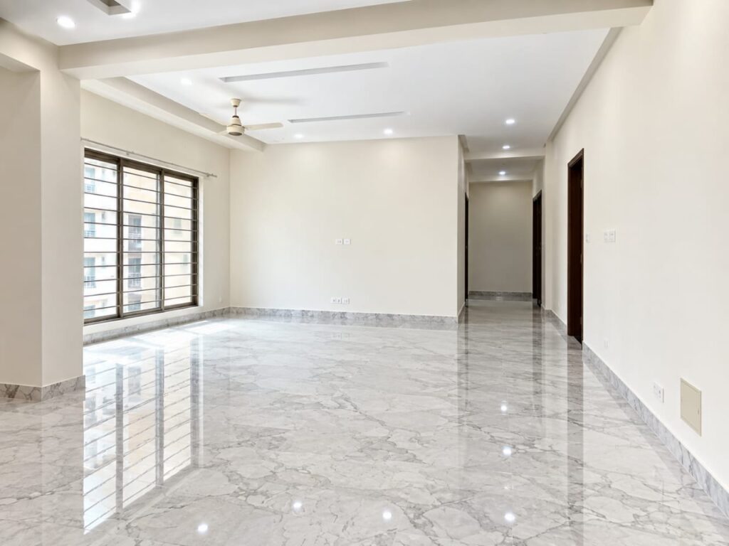 Spacious lounge with marble floor in Askari 12 Lahore apartment