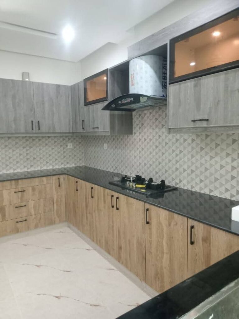 Kitchen with cabinets in Askari 12 Lahore apartment